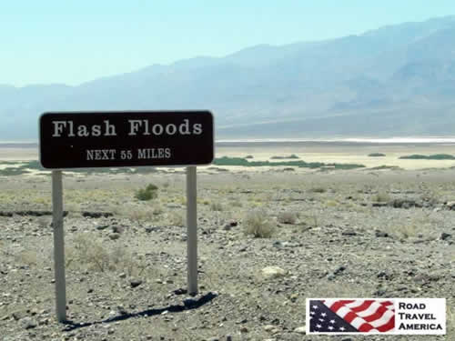 Sign warning of flash floods in Death Valley National Park, next 55 miles